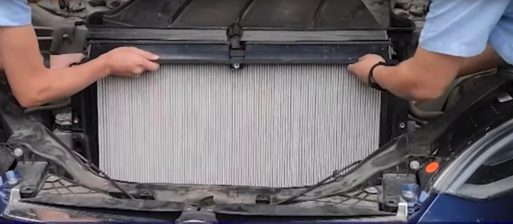 technicians install a tesla HEPA filter made by PUREFLOW