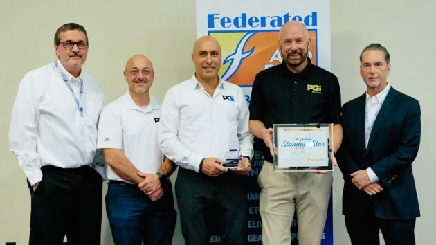 premium guard leadership team accepts fisher award